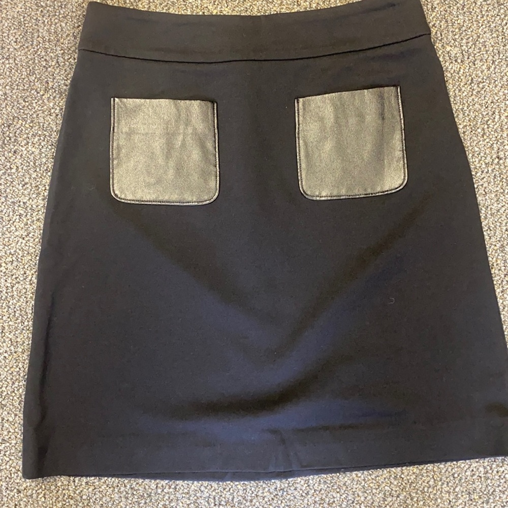 Halogen mini skirt, black with black leather pockets. Size 4P